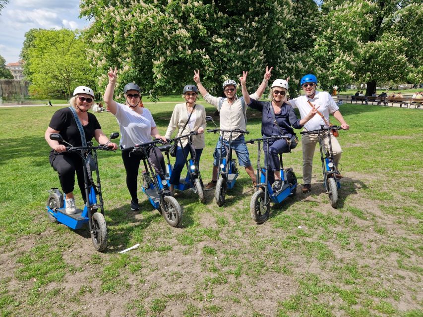 3-H Munich: Top Sights E-Scooter Tour with Local Guide - English Garden stop: Friedensengel, Biergarten atmosphere, and Eisbachsurfer