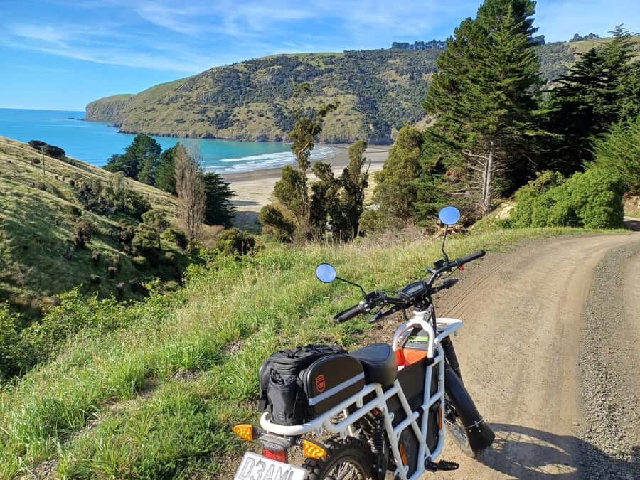 Akaroa: Lonely Beach Trail by E-Scooter. selfguided day out - Hinewai Reserve and the Stoney Bay Peak walk