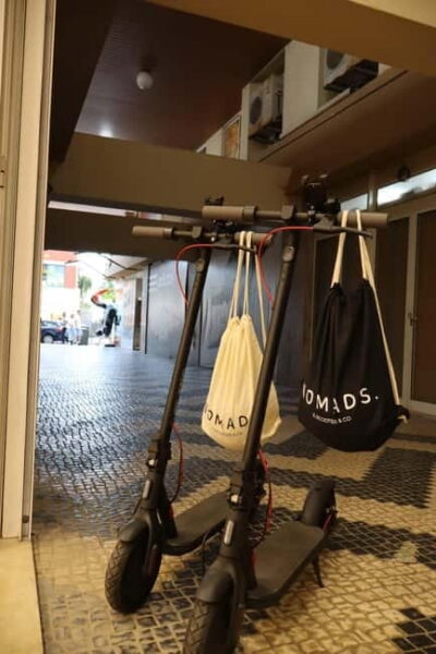 Portimão: E-Scooter Rental with Custom Routes - Meeting point and scooter setup inside the main-street gallery